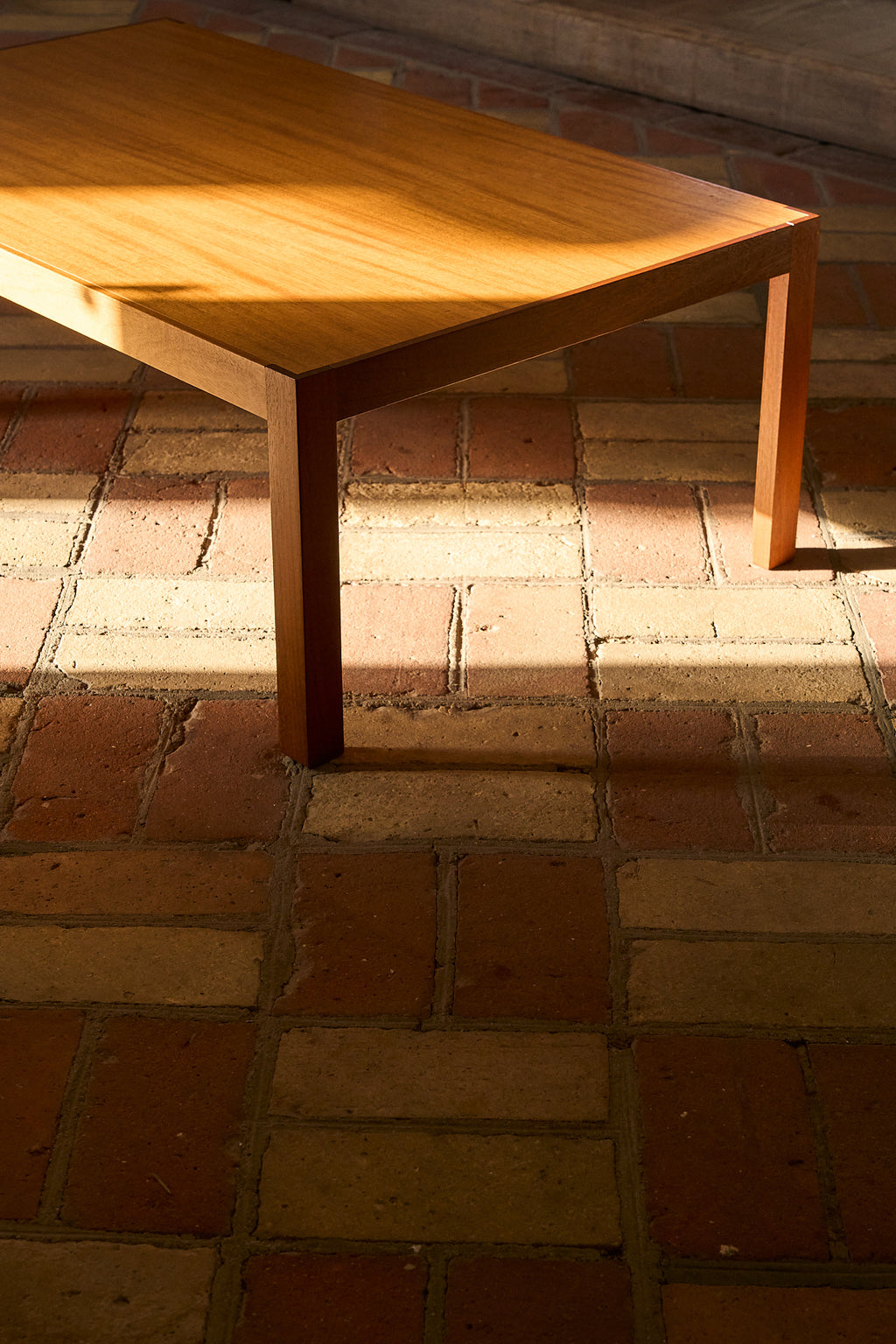 Vintage Coffee Table in Warm-Toned Wood with Minimalist Frame